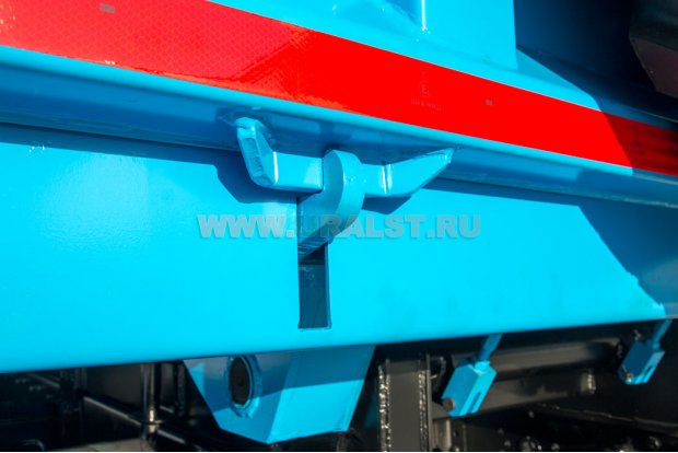 Система автоматического запирания заднего борта