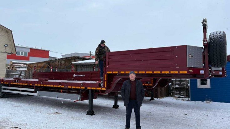 Полуприцеп тяжеловоз ППТ 45-32-12 УКБФ приставные трапы в работе